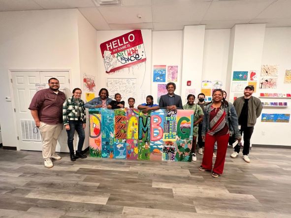 Young artists pose with their "DREAM BIG" mural on Oct. 14, 2022 at Albany Center Gallery's Art.Work.Space in Albany N.Y. They created the mural during a summer-long Summer Meals Collaborative program that connected kids to arts programming and regular meals, thanks to a collaboration with Albany Center Gallery, Albany Housing Authority and United Way of the Greater Capital Region. 